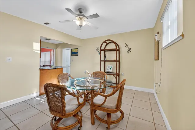 a dining room with furniture and window