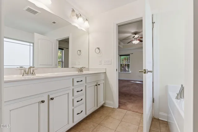 a view of a livingroom with an empty space and a window