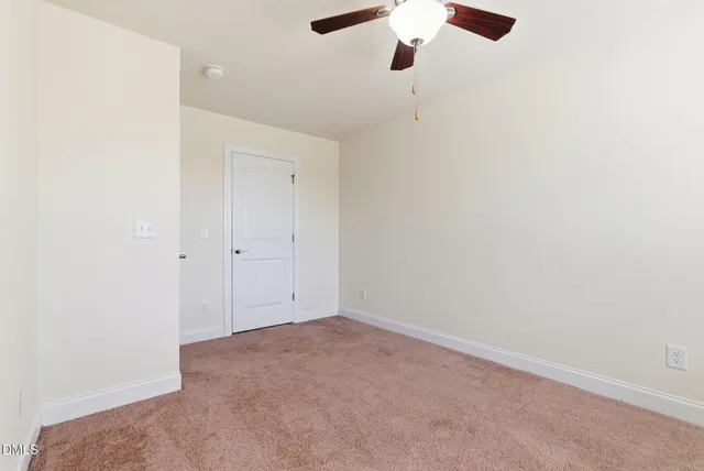a kitchen with granite countertop white cabinets and stainless steel appliances