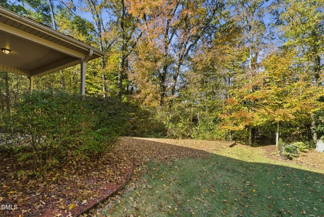 an aerial view of house with yard swimming pool and outdoor seating