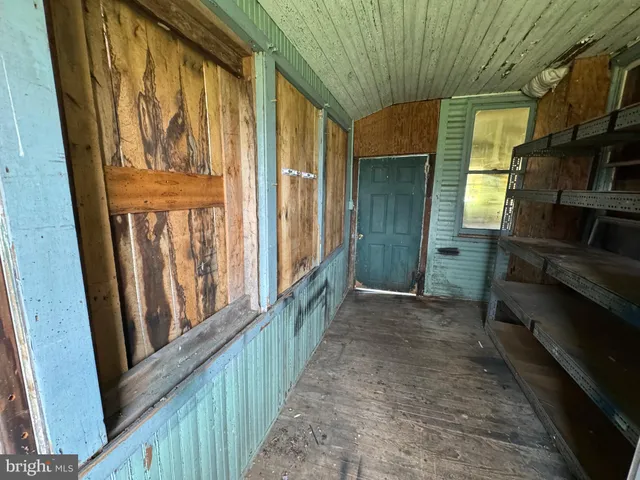 a kitchen with a refrigerator and a stove top oven