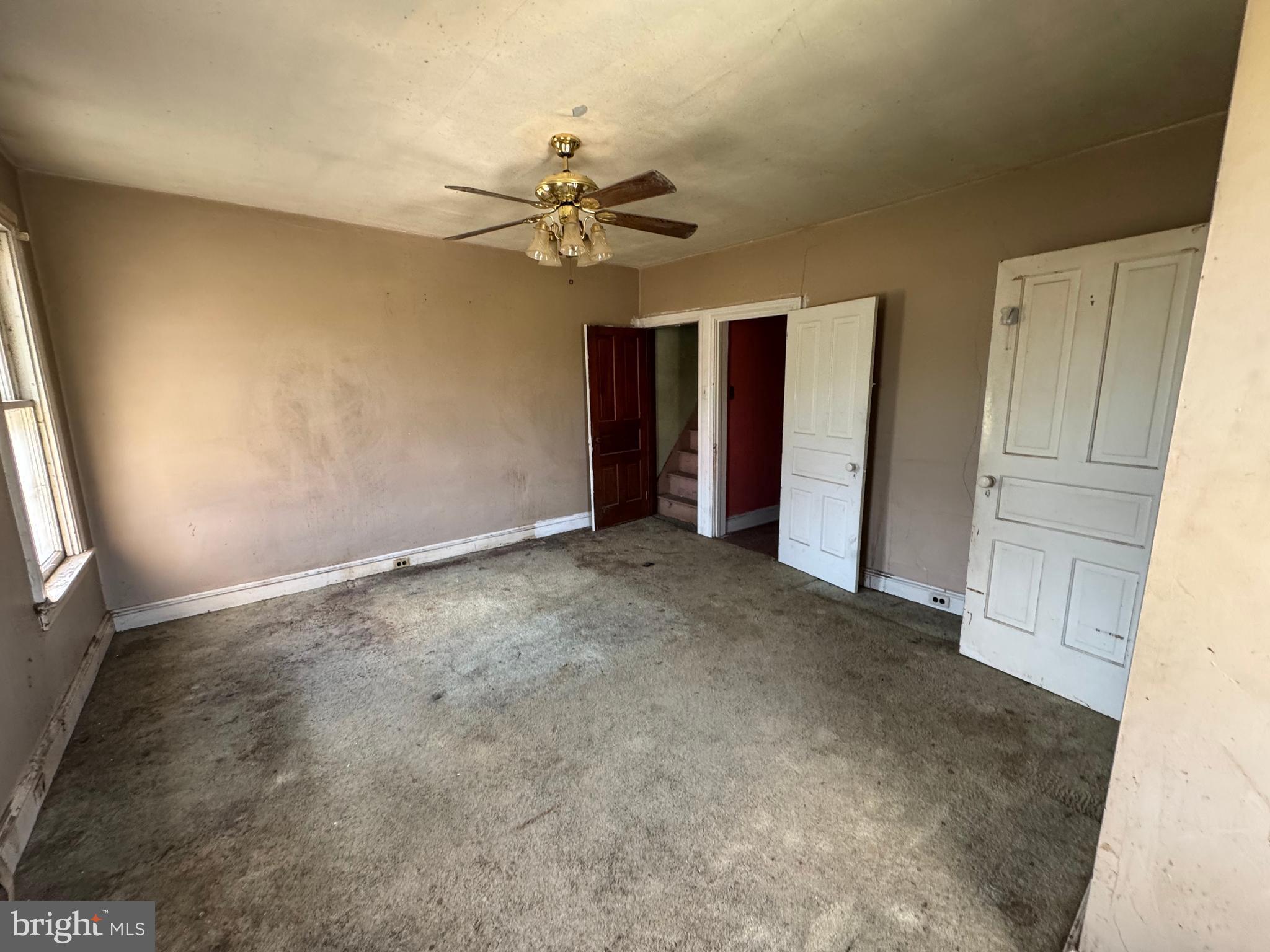 1951 Park Street Dover, PA 17315 - Photo 25 of 38 an empty room with chandelier fan and windows