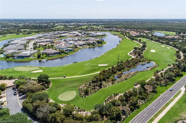 a view of a golf course with a big yard