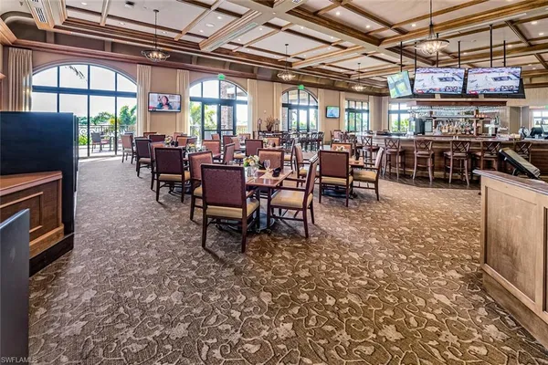 a large room with lots of chairs and mirrors