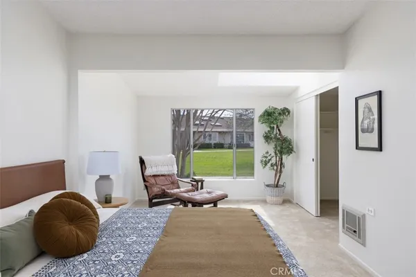 a living room with furniture and a garden