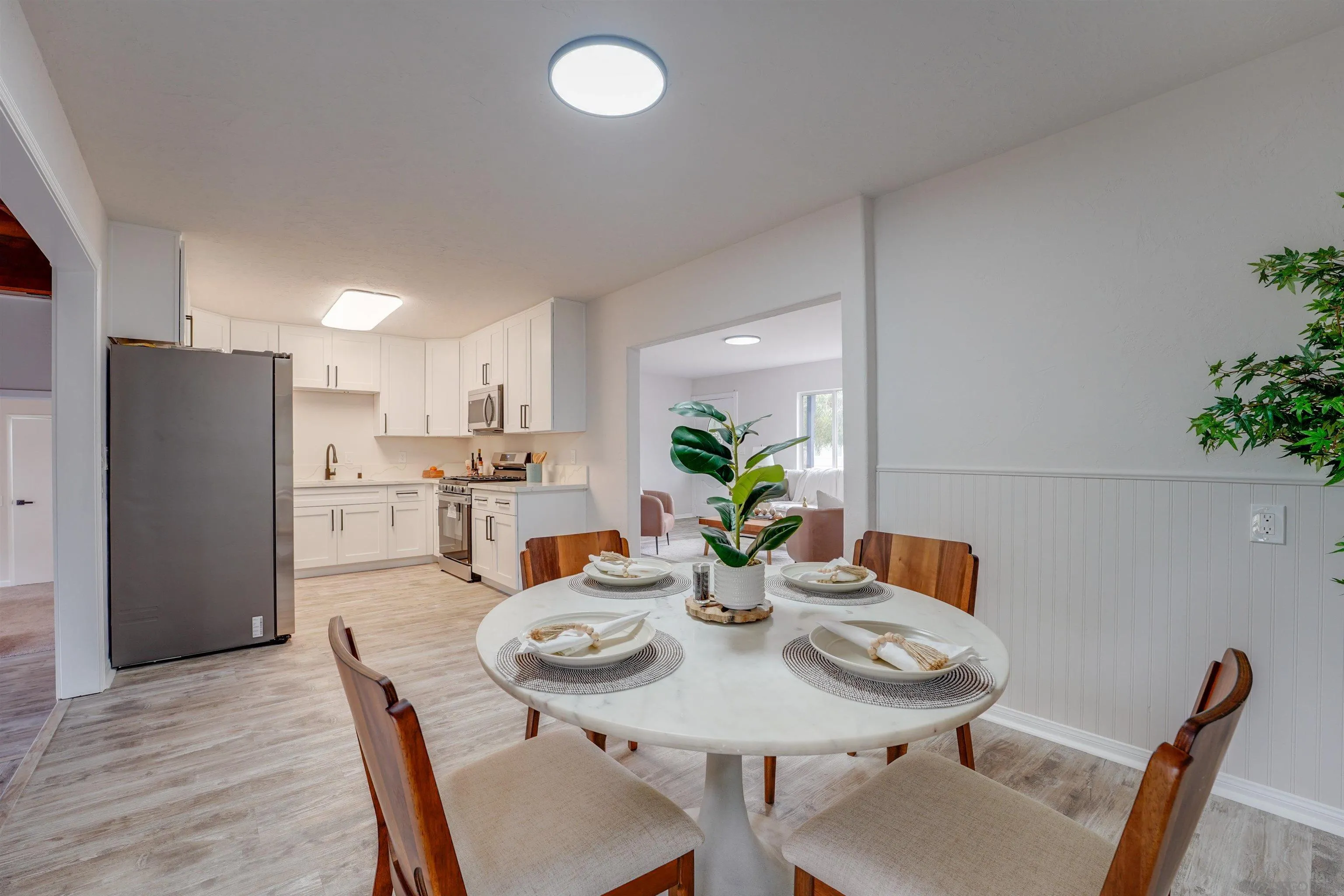 674 Palomar Avenue El Cajon, CA 92020 - Photo 17 of 56 a view of a dining room with furniture and wooden floor