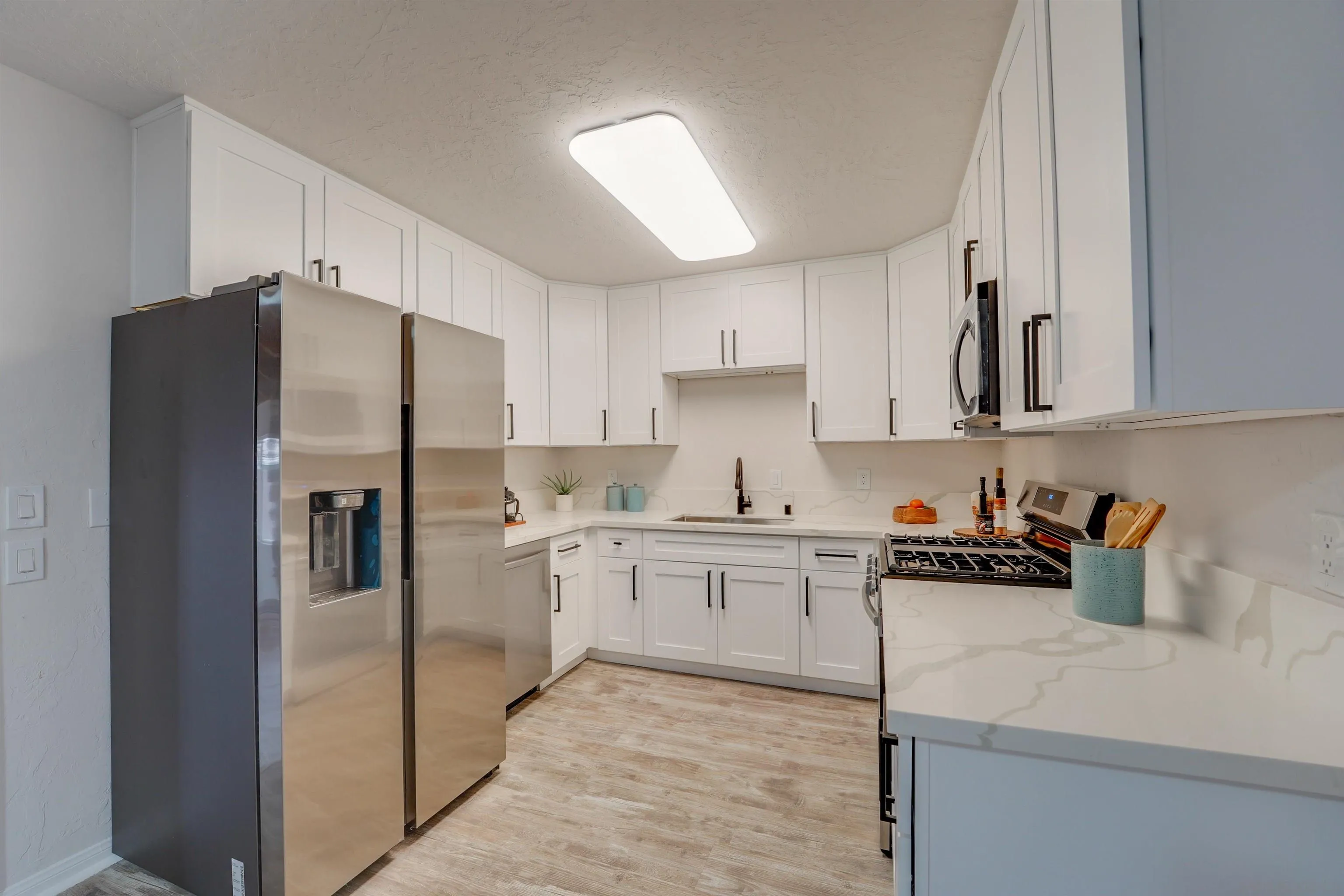 674 Palomar Avenue El Cajon, CA 92020 - Photo 23 of 56 a kitchen with stainless steel appliances a refrigerator sink and cabinets
