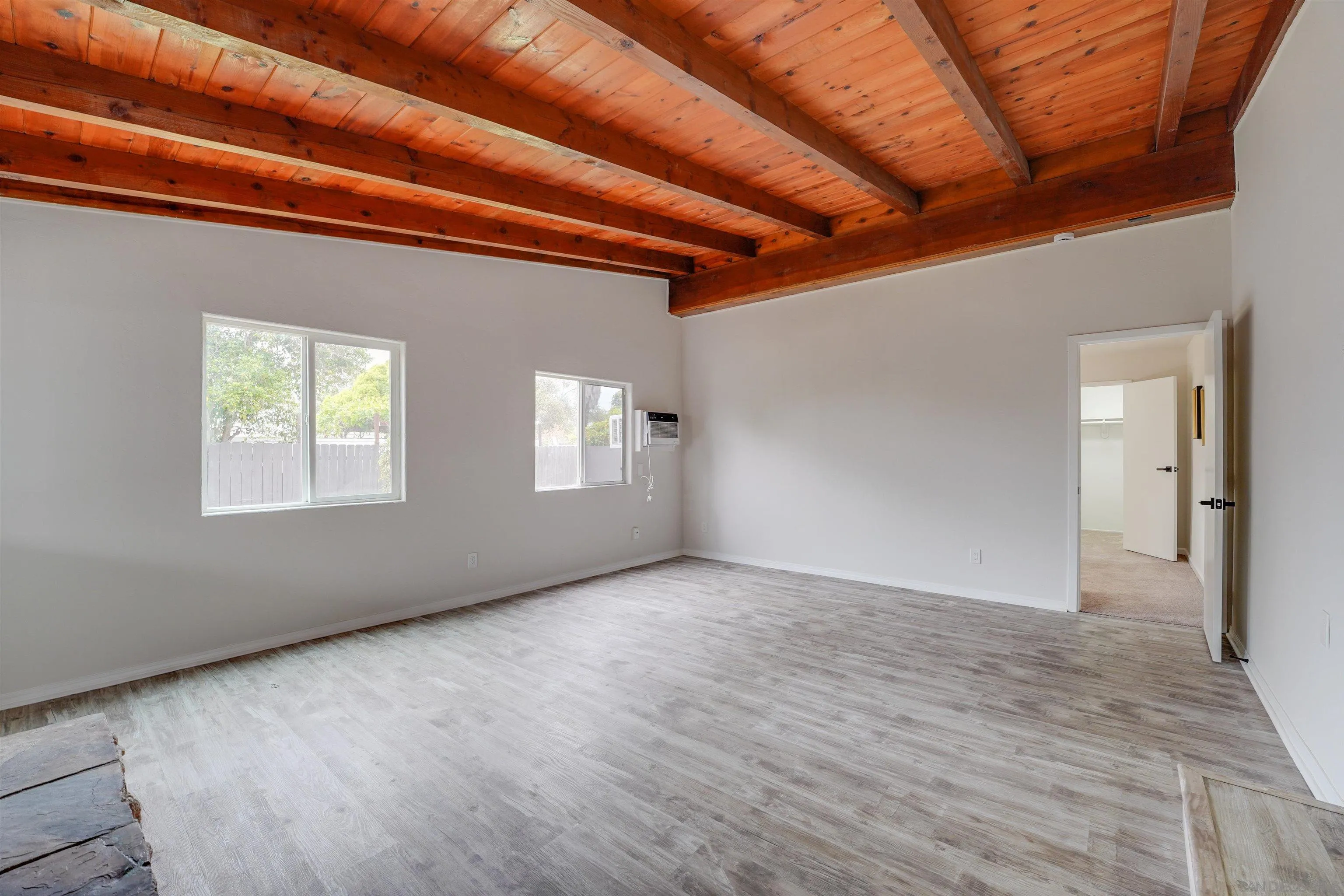 674 Palomar Avenue El Cajon, CA 92020 - Photo 29 of 56 a view of an empty room with wooden floor and a window