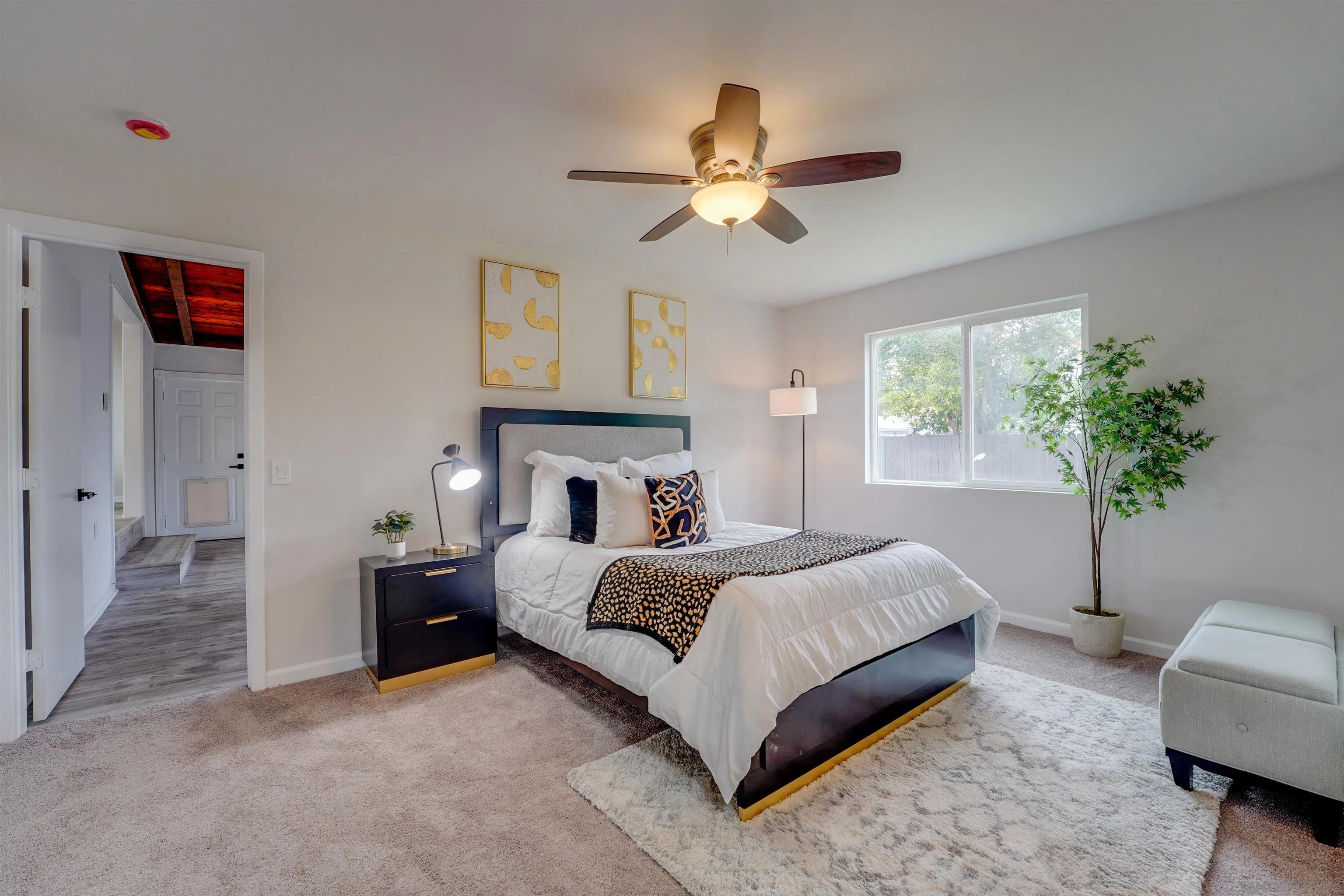 674 Palomar Avenue El Cajon, CA 92020 - Photo 31 of 56 a living room with a bed furniture and a chandelier