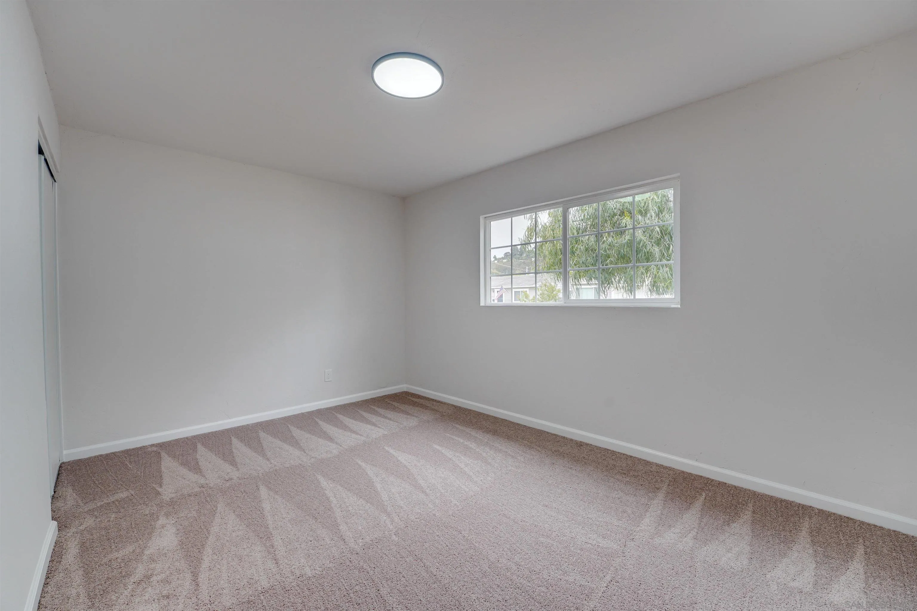674 Palomar Avenue El Cajon, CA 92020 - Photo 39 of 56 an empty room with windows
