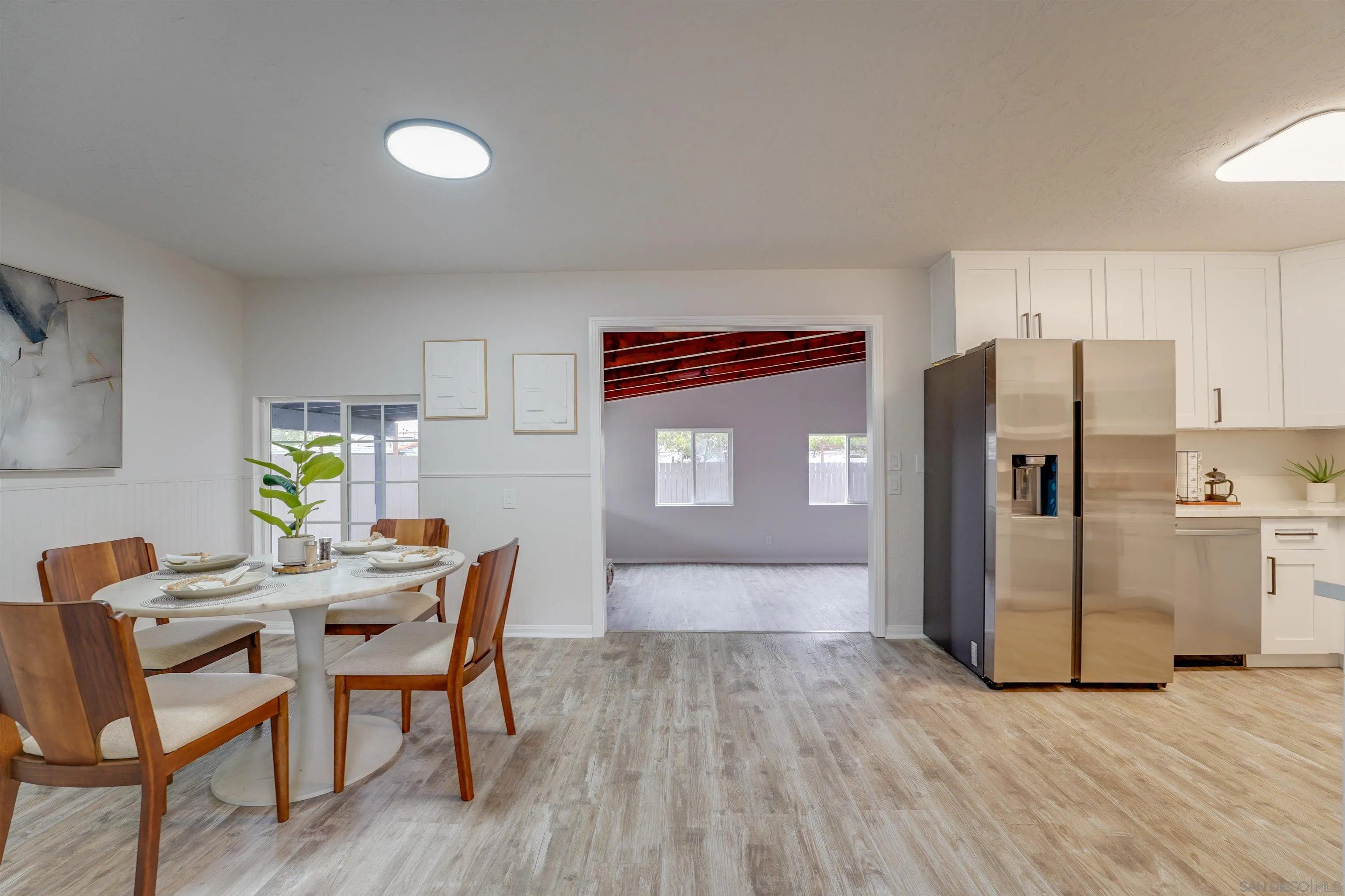 674 Palomar Avenue El Cajon, CA 92020 - Photo 10 of 56 a view of a dining room with furniture and wooden floor