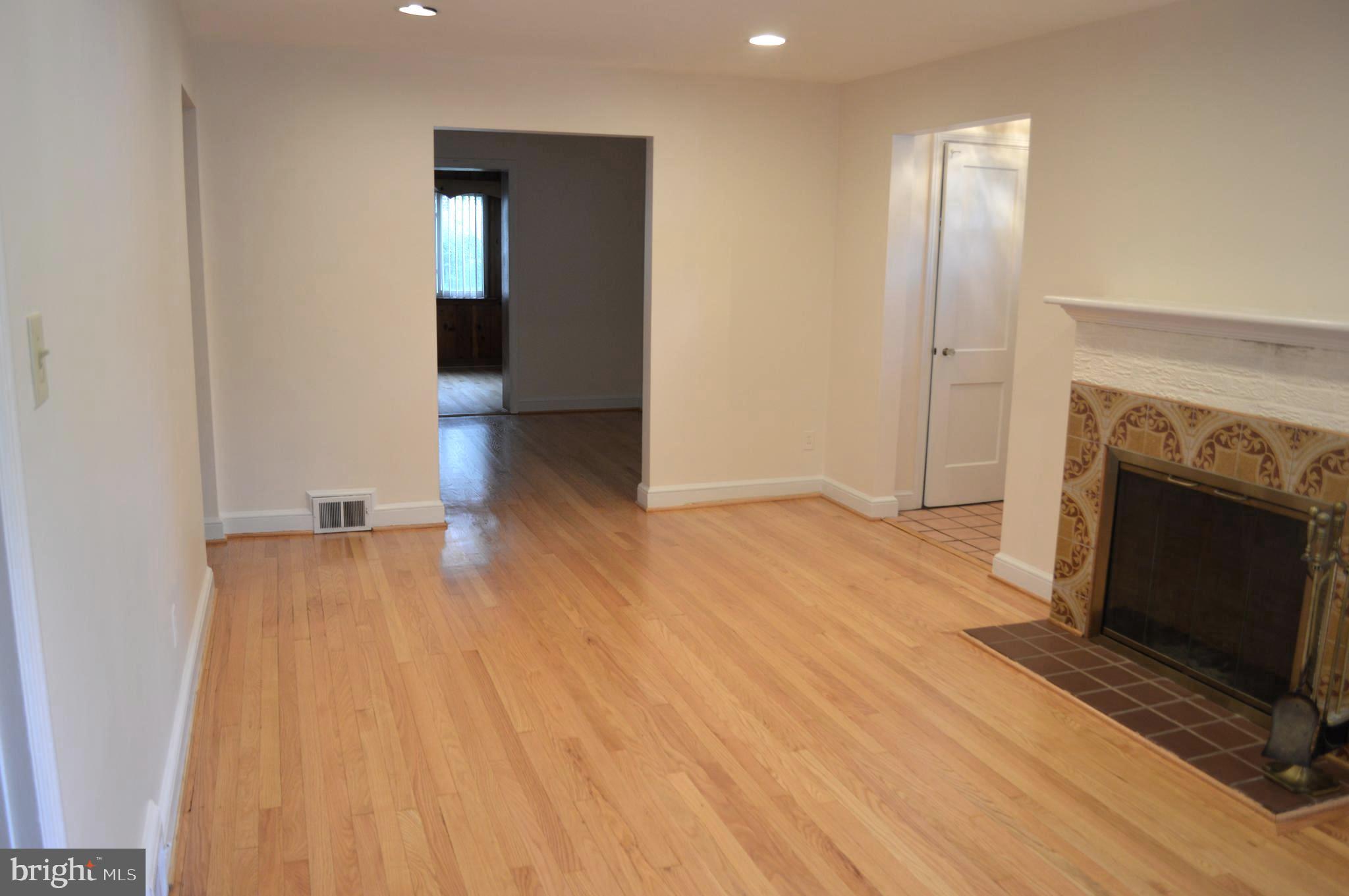 9115 Wire Avenue Silver Spring, MD 20901 - Photo 11 of 46 Living room with fireplace