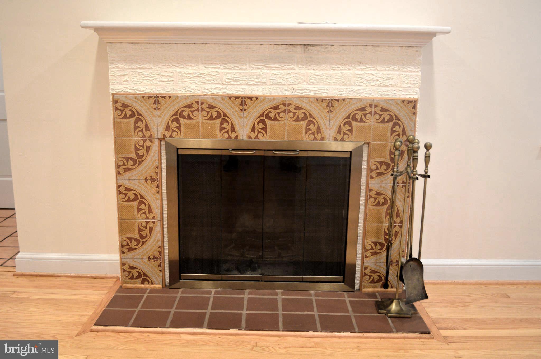 9115 Wire Avenue Silver Spring, MD 20901 - Photo 13 of 46 Fireplace with ceramic tile