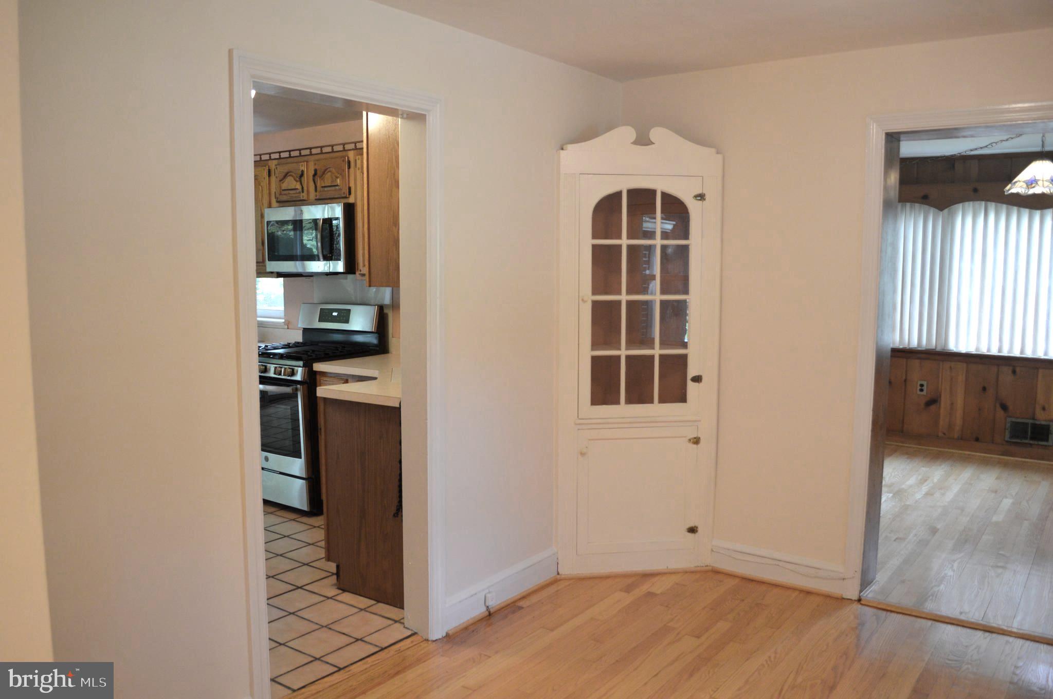 9115 Wire Avenue Silver Spring, MD 20901 - Photo 17 of 46 View of kitchen and den from dining room