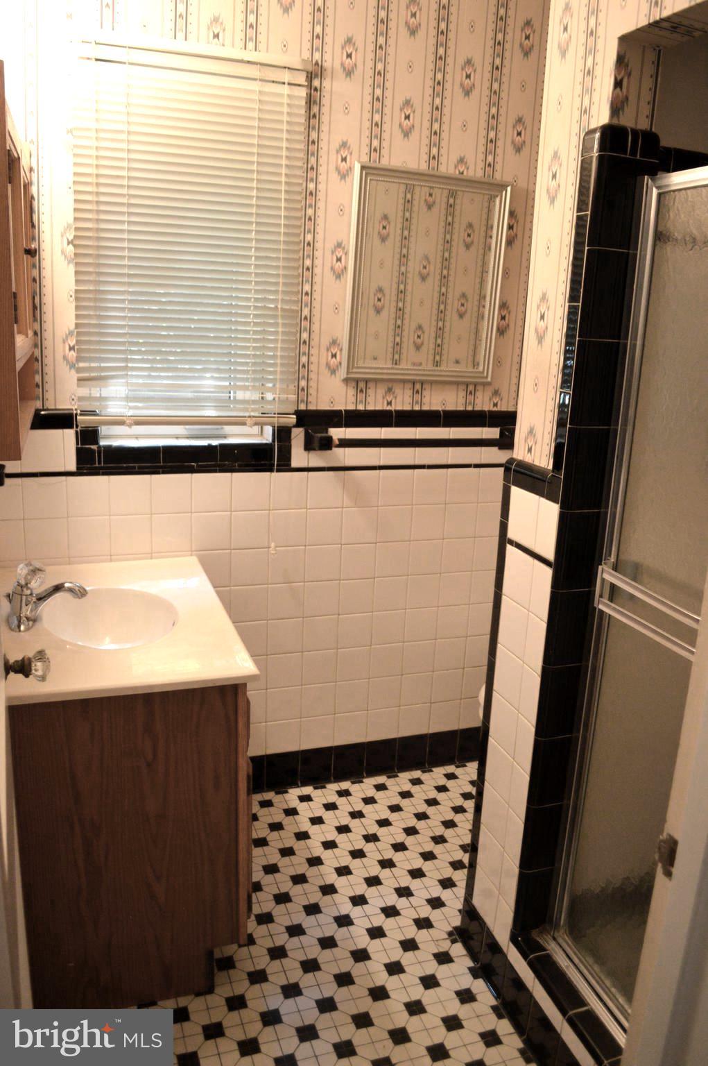 9115 Wire Avenue Silver Spring, MD 20901 - Photo 23 of 46 Main level bathroom with shower