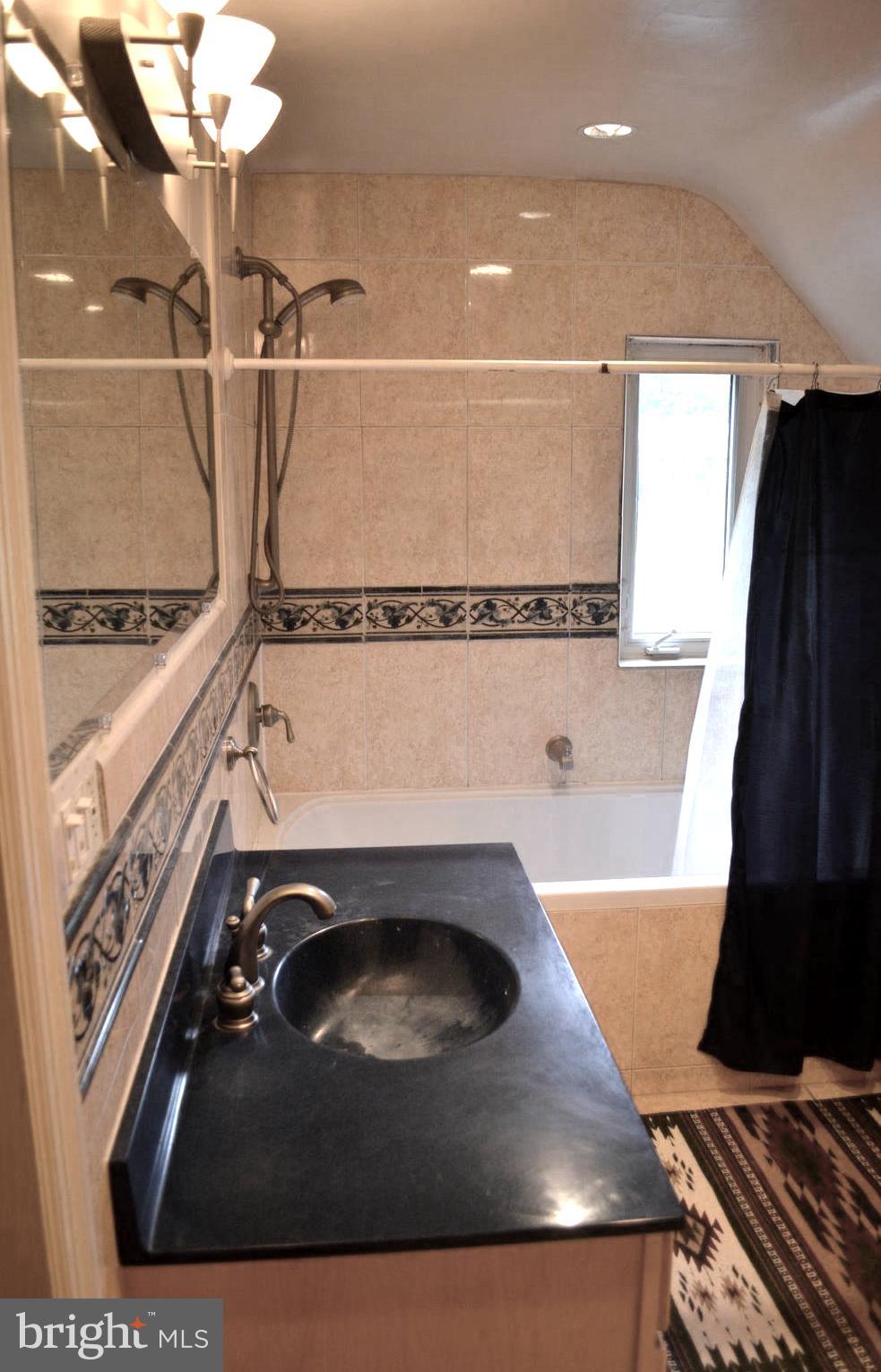 9115 Wire Avenue Silver Spring, MD 20901 - Photo 40 of 46 Another view of large half bathroom with whirlpool