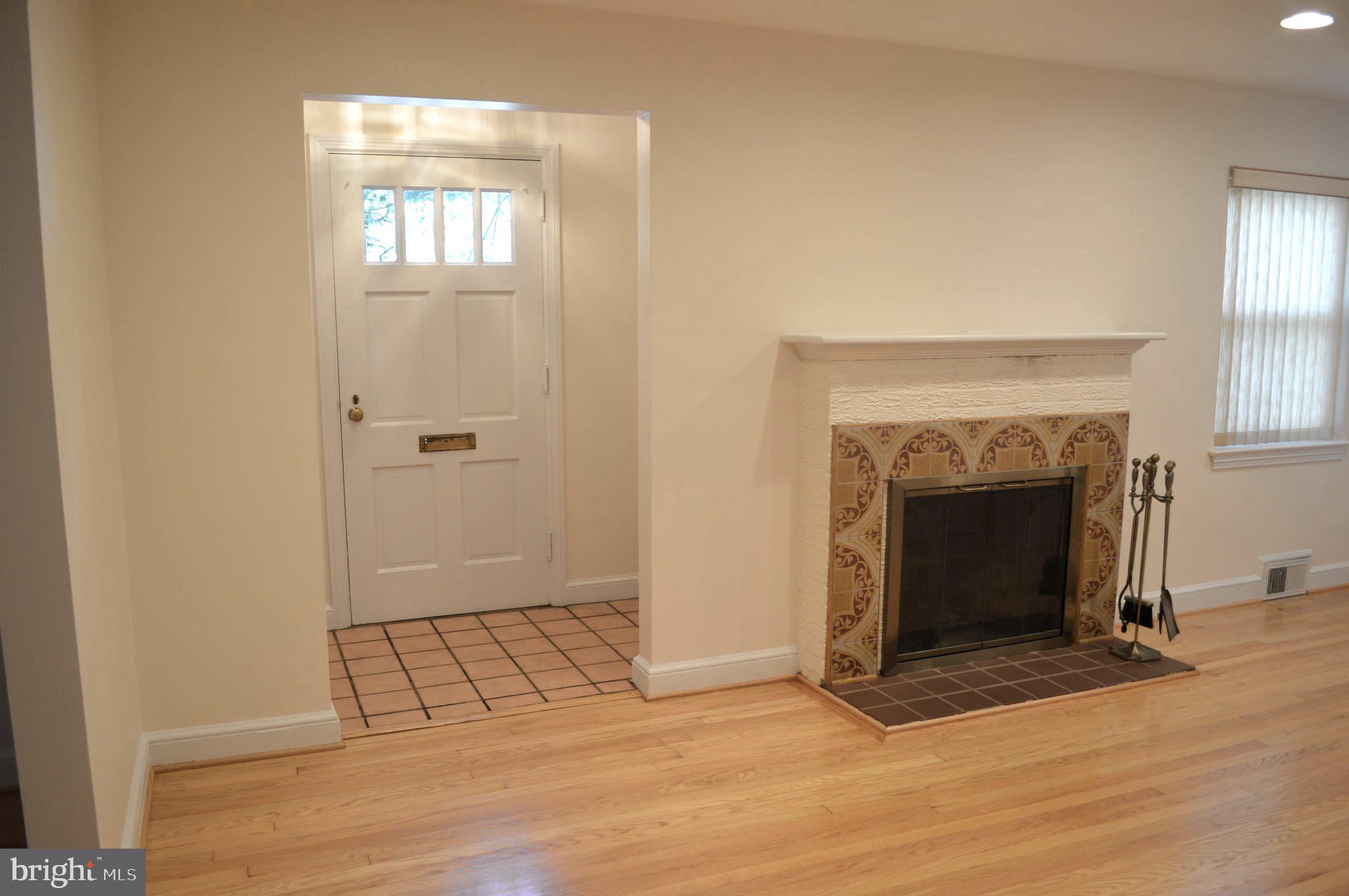 9115 Wire Avenue Silver Spring, MD 20901 - Photo 9 of 46 View of entry foyer and fireplace