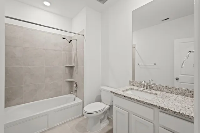 an empty room with a chandelier fan