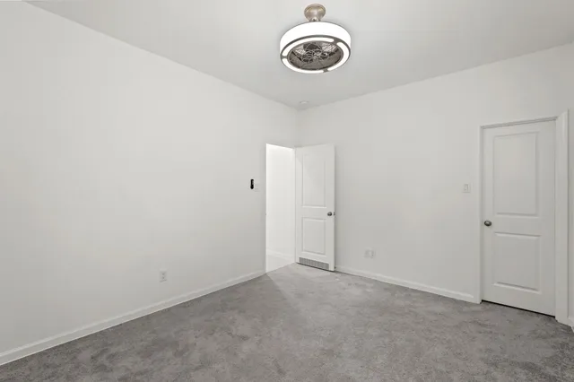 a view of a room with a fan