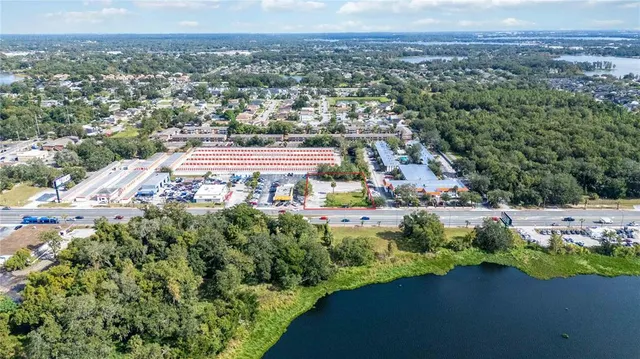 an aerial view of a house with lake view