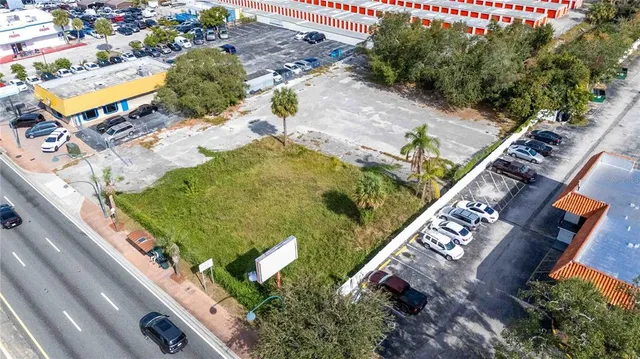 an aerial view of a house with outdoor space
