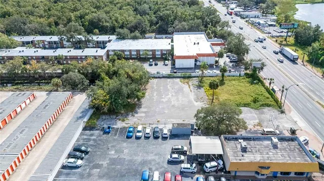 an aerial view of a house with a lake view
