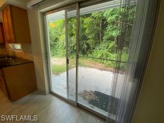 27677 Okeana Street, Unit 6 Bonita Springs, FL 34134 - Photo 21 of 31 a view of a glass door and porch