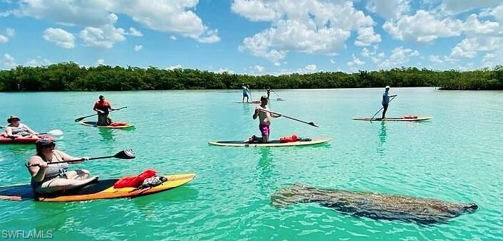 27677 Okeana Street, Unit 6 Bonita Springs, FL 34134 - Photo 27 of 31 a garden view with a lake view