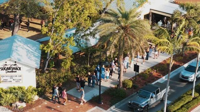 27677 Okeana Street, Unit 6 Bonita Springs, FL 34134 - Photo 4 of 31 a view of a house with a tree