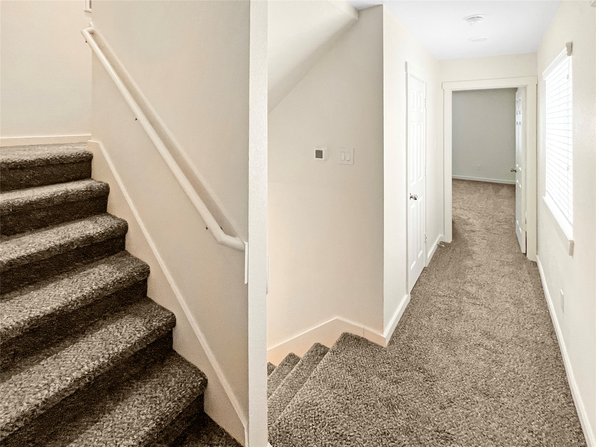 12603 Telge Road, Unit 8EH Cypress, TX 77429 - Photo 24 of 32 a view of a hallway with wooden floor and entryway