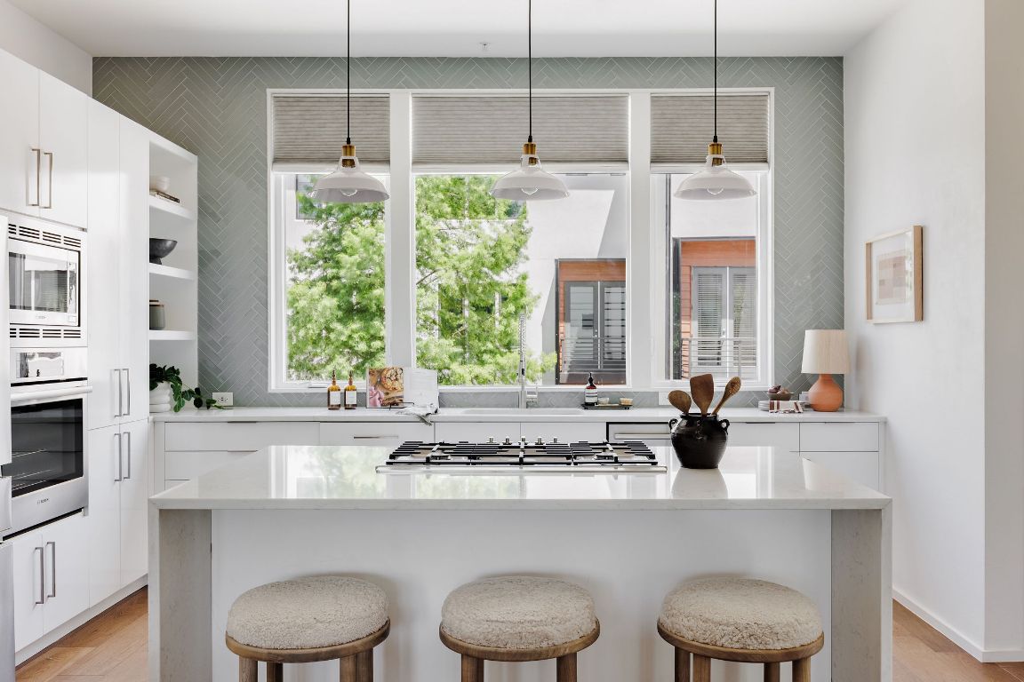 3100 Menchaca Road, Unit 6 Austin, TX 78704 - Photo 11 of 30 a kitchen with a stove a sink and a window