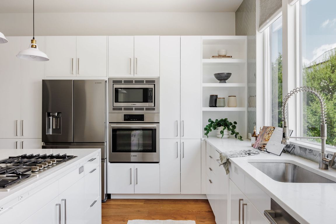 3100 Menchaca Road, Unit 6 Austin, TX 78704 - Photo 12 of 30 a kitchen with a sink stove and refrigerator