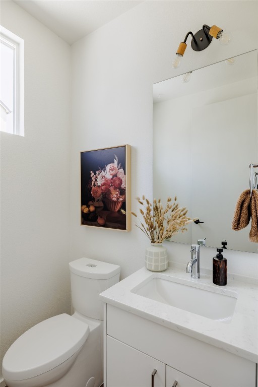 3100 Menchaca Road, Unit 6 Austin, TX 78704 - Photo 16 of 30 a bathroom with a toilet a sink and mirror