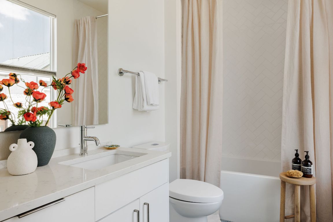 3100 Menchaca Road, Unit 6 Austin, TX 78704 - Photo 19 of 30 a bathroom with a sink toilet and shower