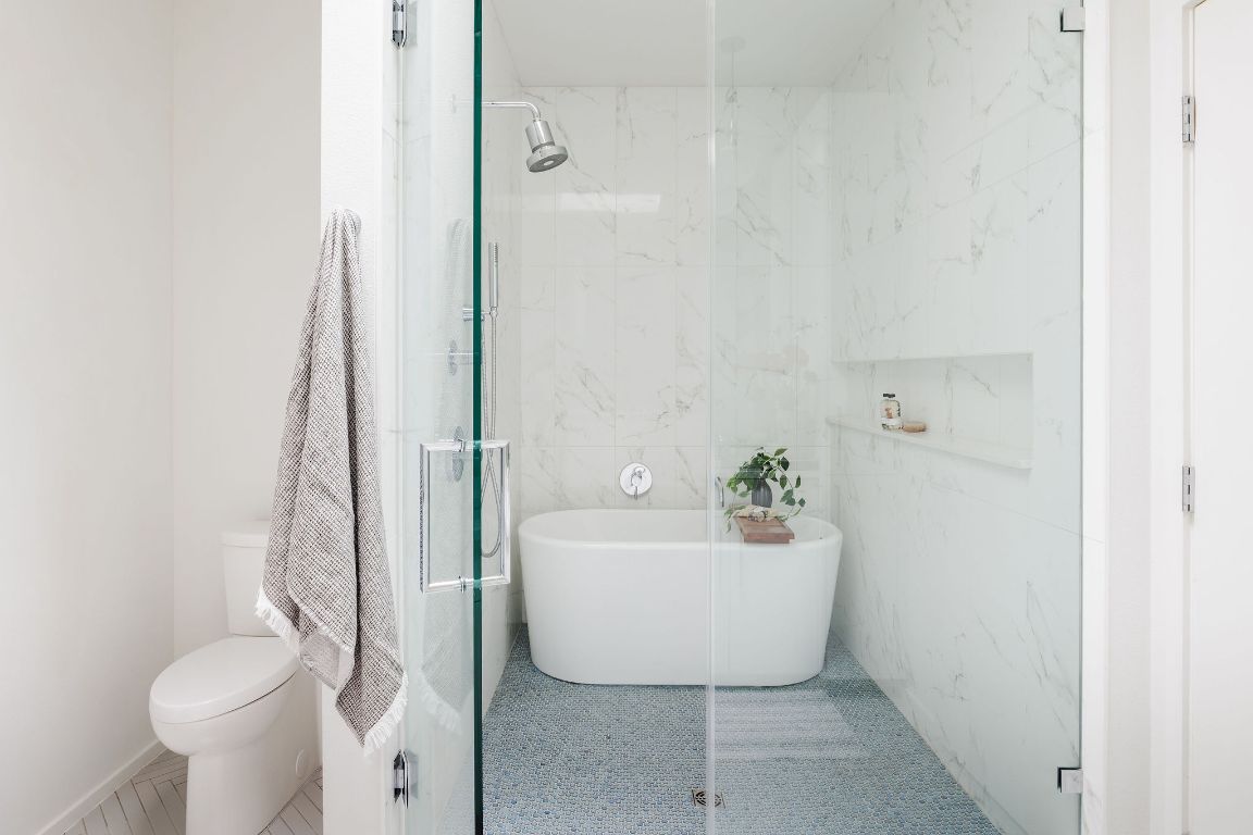 3100 Menchaca Road, Unit 6 Austin, TX 78704 - Photo 24 of 30 a bathroom with a sink toilet and shower