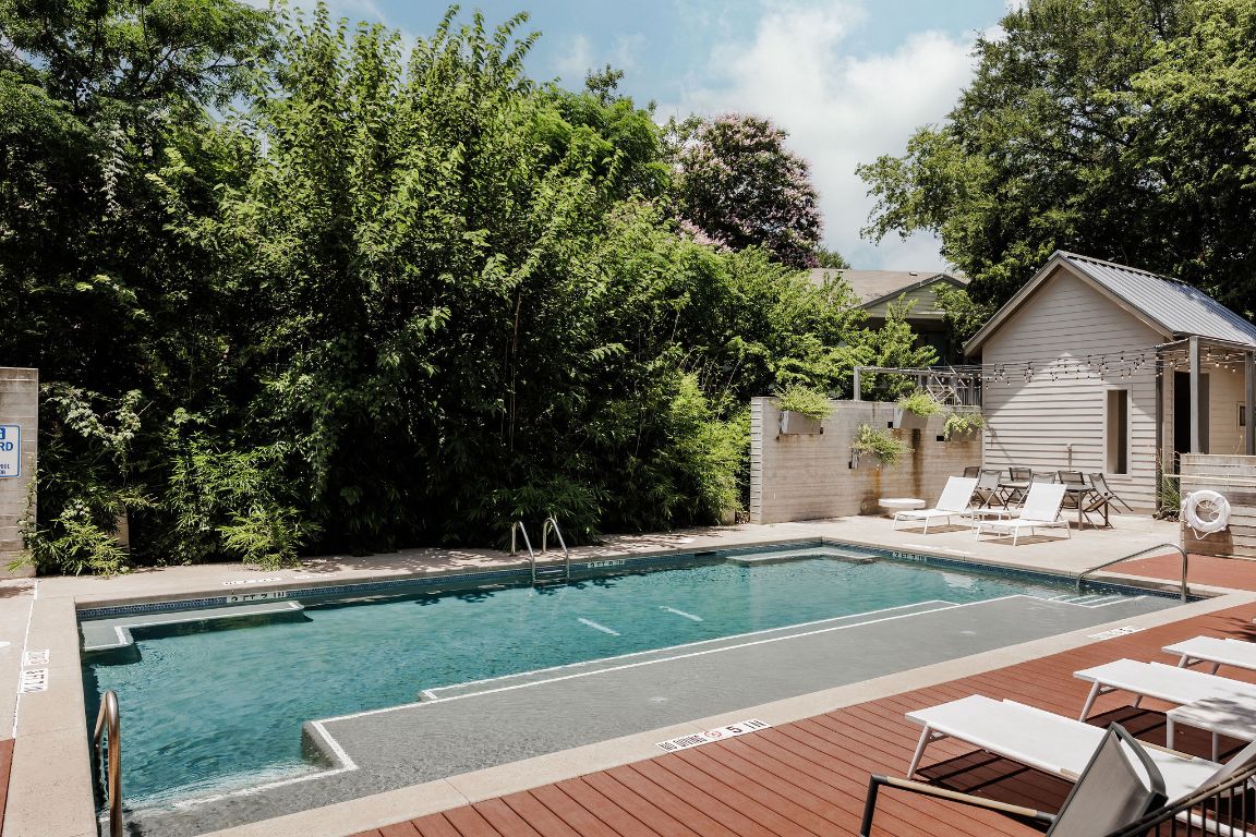 3100 Menchaca Road, Unit 6 Austin, TX 78704 - Photo 4 of 30 a view of a house with swimming pool and sitting area