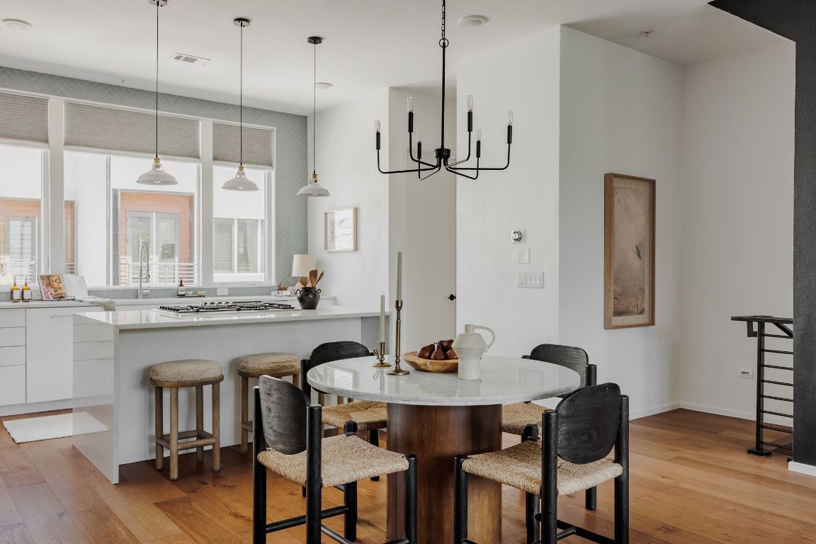 3100 Menchaca Road, Unit 6 Austin, TX 78704 - Photo 9 of 30 a kitchen that has a table and chairs in it
