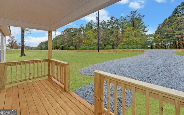 a view of a deck with a yard