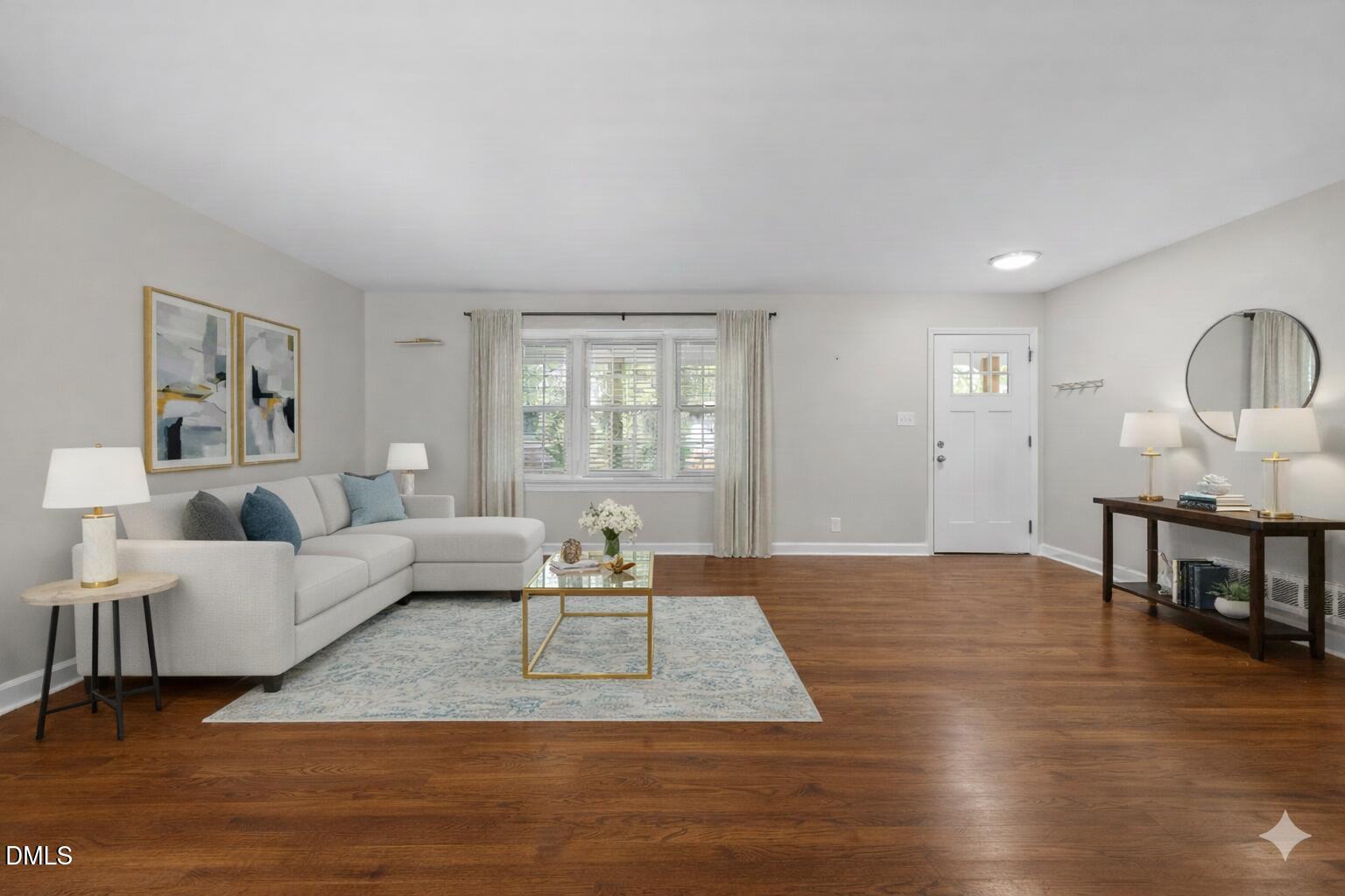2950 Glenridge Drive Raleigh, NC 27604 - Photo 16 of 53 a living room with furniture wooden floor and a window