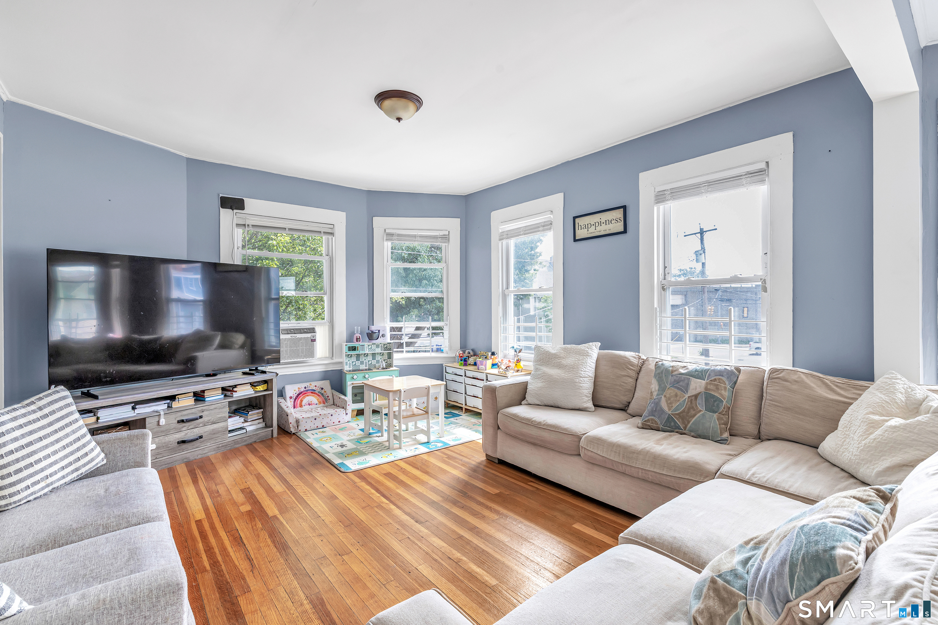 189 Wells Street Bridgeport, CT 06606 - Photo 5 of 40 2nd Floor - Offers 1389 sq ft -Shared LR & DR has operable wood burning fireplace, hardwood floors