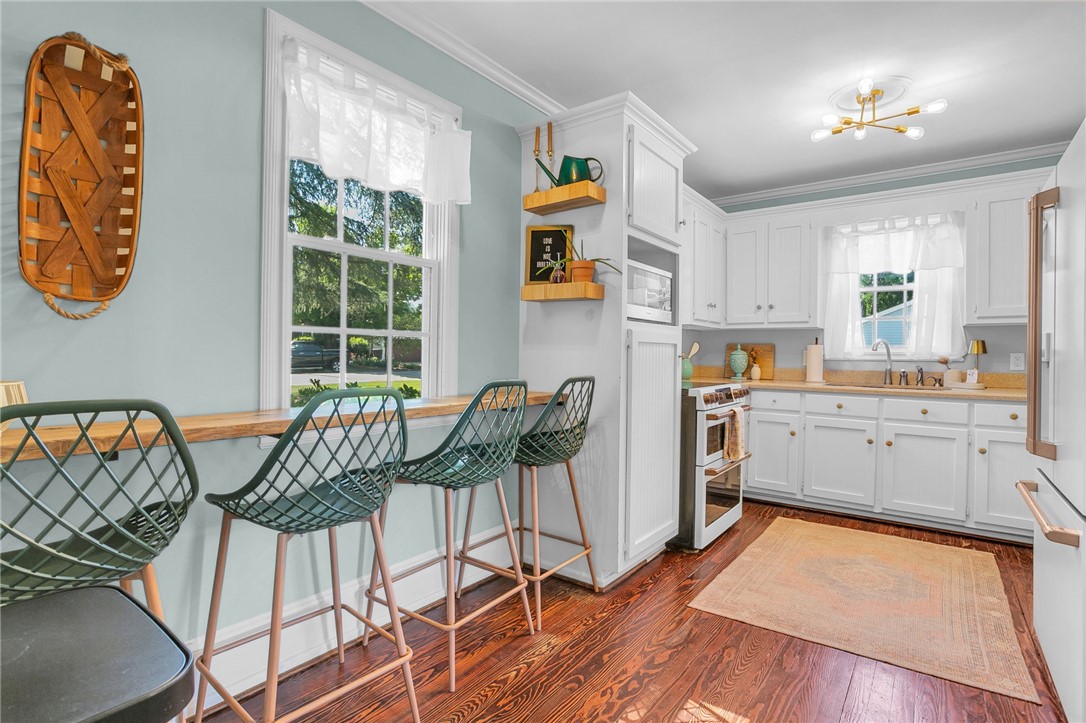 1107 Springdale Road Anderson, SC 29621 - Photo 14 of 49 This bright kitchen offers a practical layout with beautiful hardwood floors.