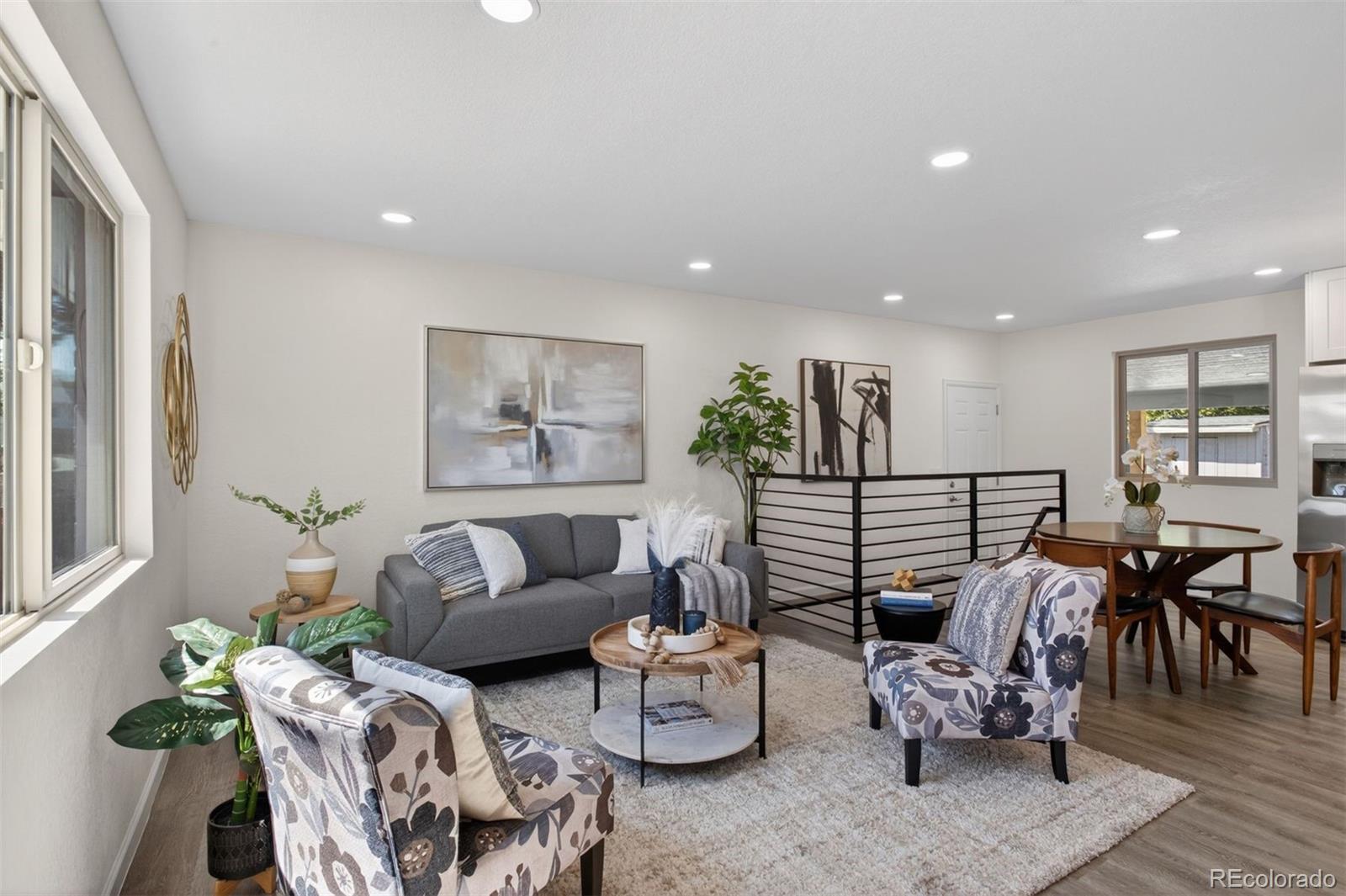 9079 Dudley Street Westminster, CO 80021 - Photo 1 of 37 a living room with furniture and wooden floor