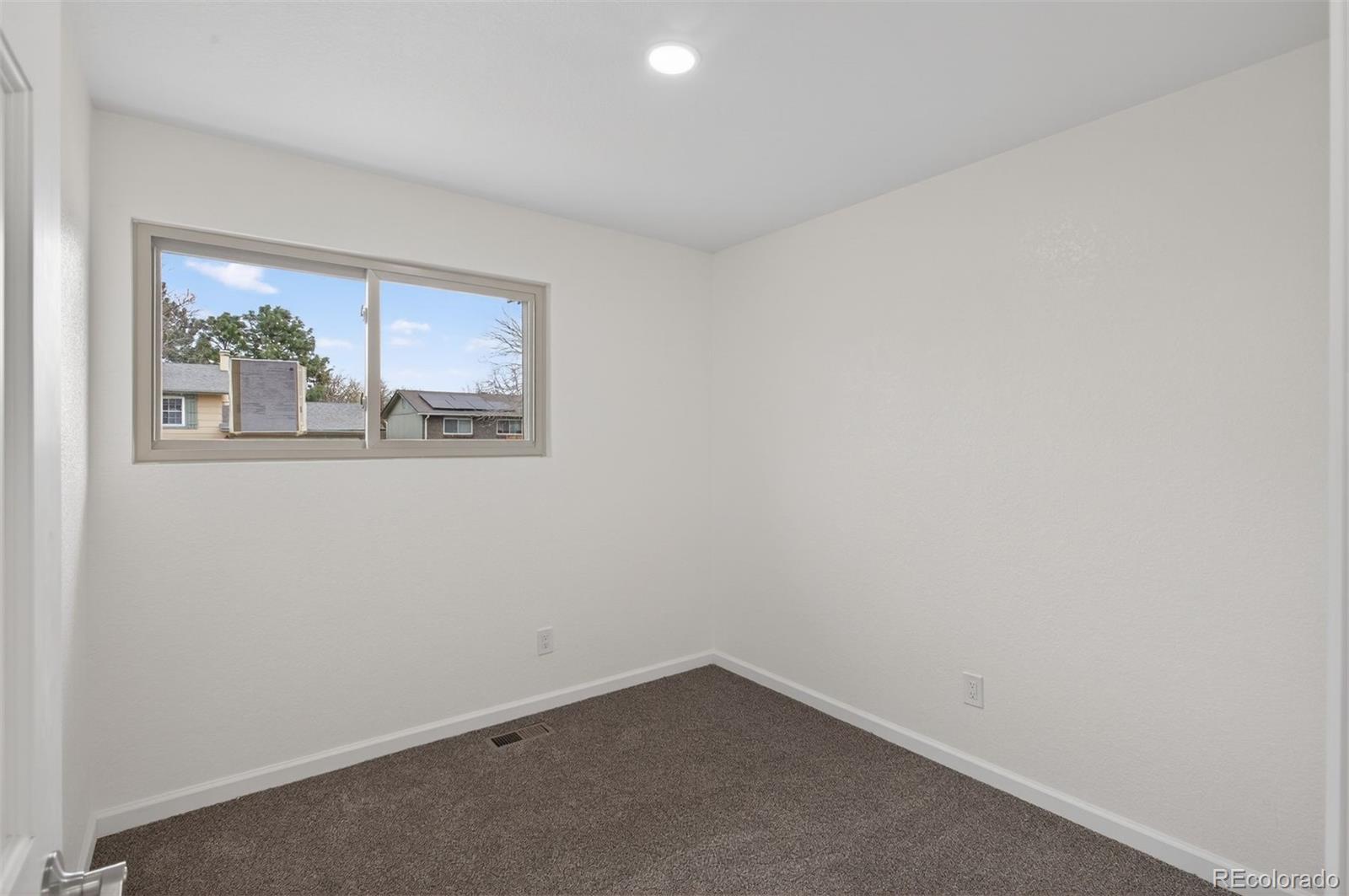 9079 Dudley Street Westminster, CO 80021 - Photo 15 of 37 an empty room with a window