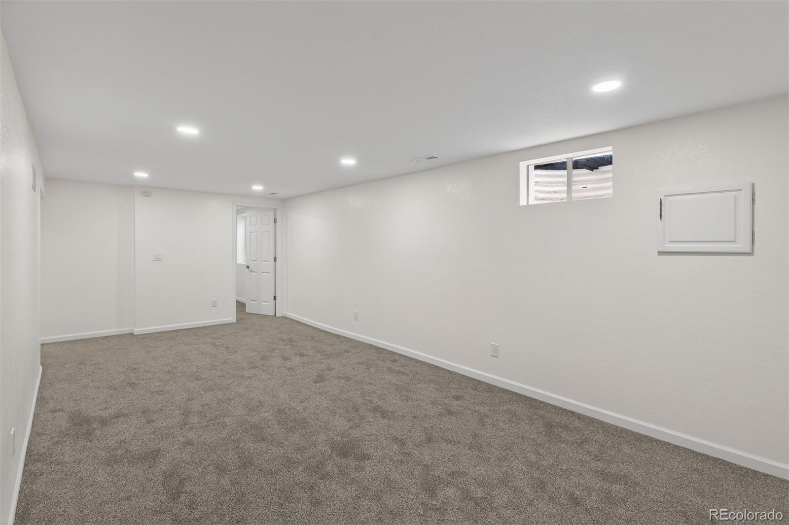 9079 Dudley Street Westminster, CO 80021 - Photo 19 of 37 an empty room with windows