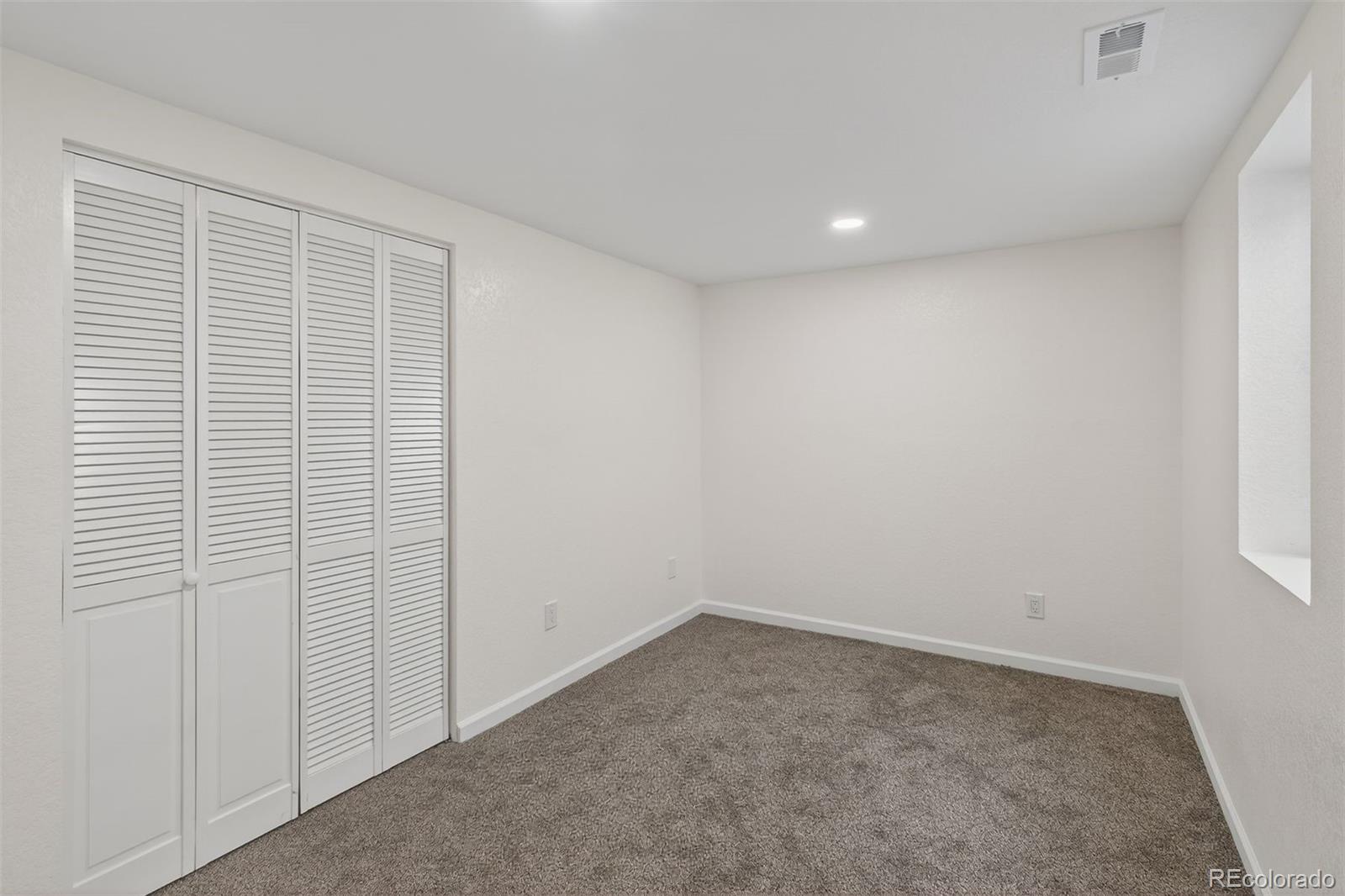 9079 Dudley Street Westminster, CO 80021 - Photo 21 of 37 wooden floor in an empty room