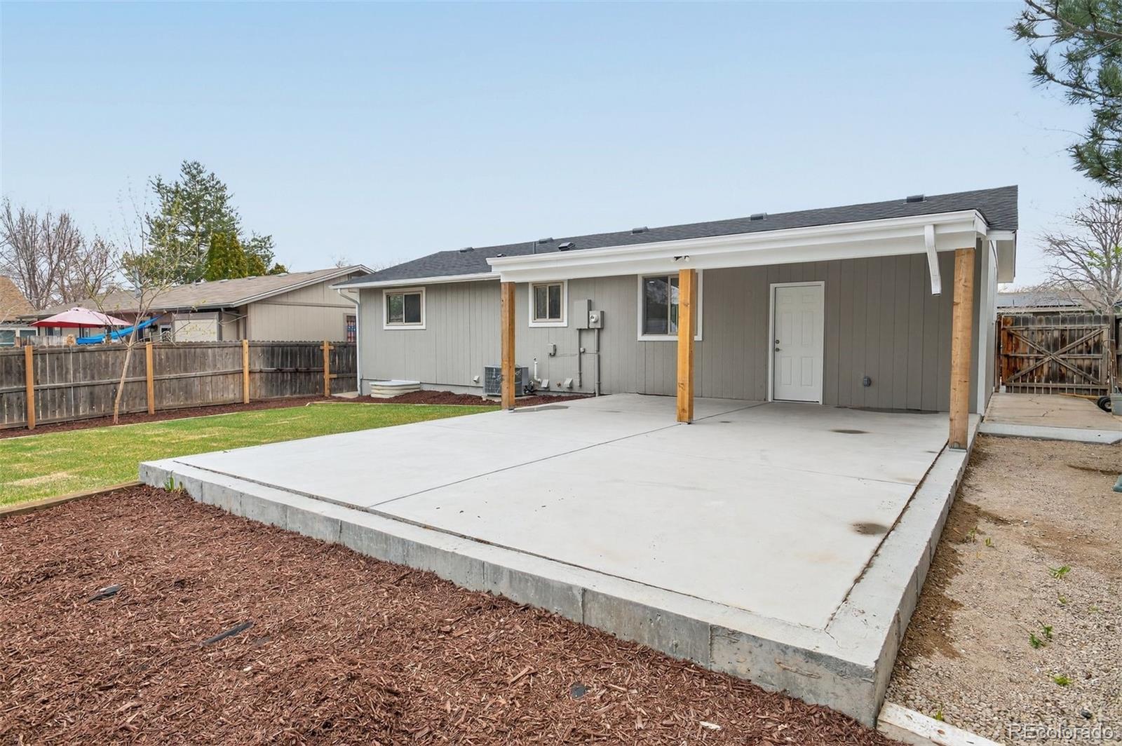 9079 Dudley Street Westminster, CO 80021 - Photo 29 of 37 a view of a house with a backyard