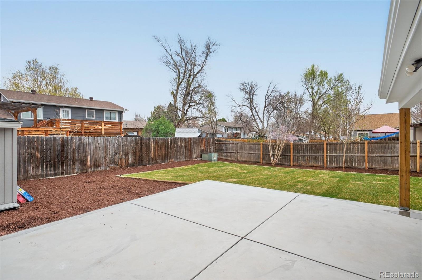 9079 Dudley Street Westminster, CO 80021 - Photo 33 of 37 a view of a backyard
