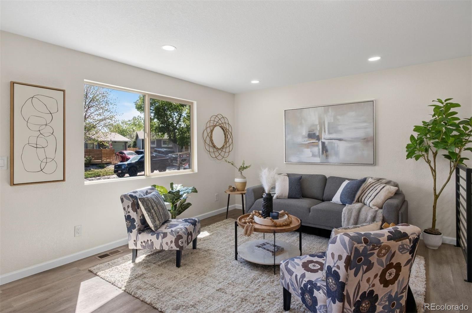 9079 Dudley Street Westminster, CO 80021 - Photo 4 of 37 a living room with furniture and a large window
