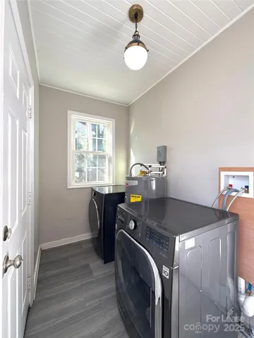 a utility room with closet dryer and washer