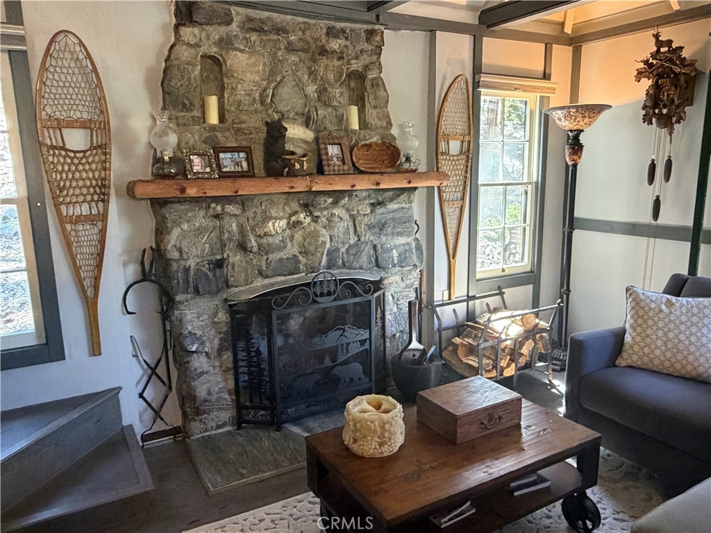 120 Barton Flats Road Angelus Oaks, CA 92305 - Photo 17 of 57 a living room with furniture and a fireplace